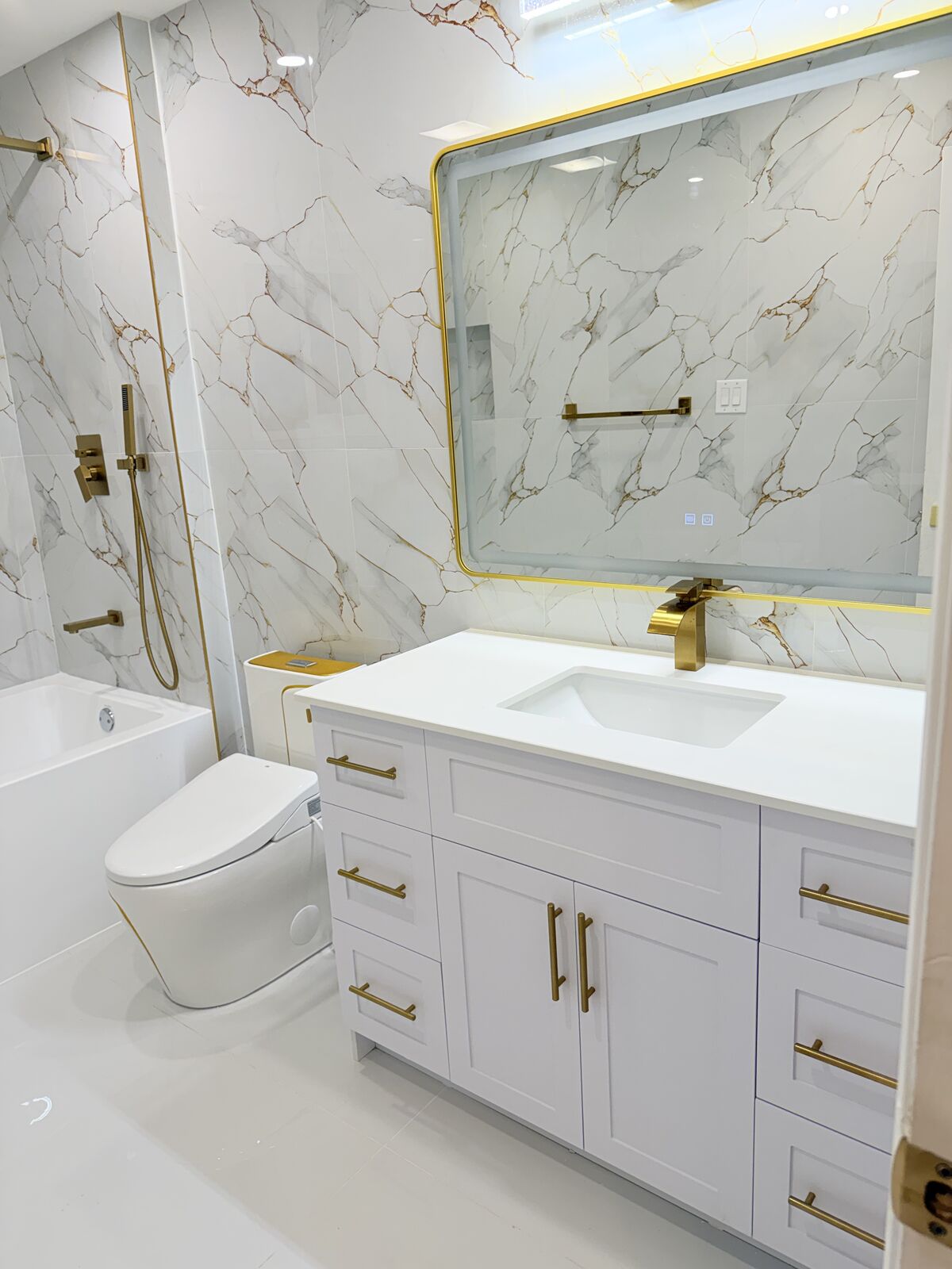 Gold-Accent Marble Bathroom